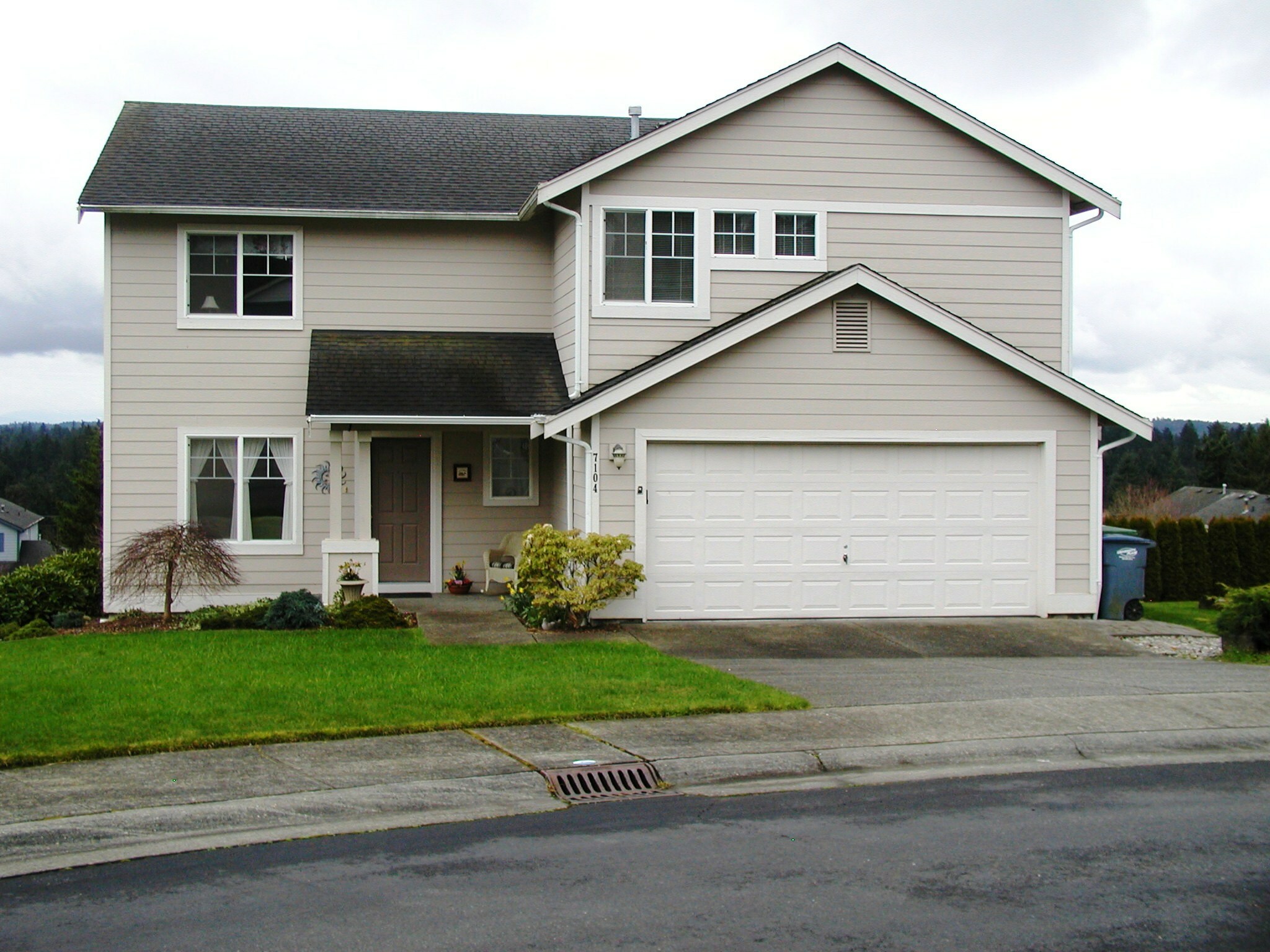 Property Photo: Home exterior, deck porch and grounds 7104 58th Stct W  WA 98467 