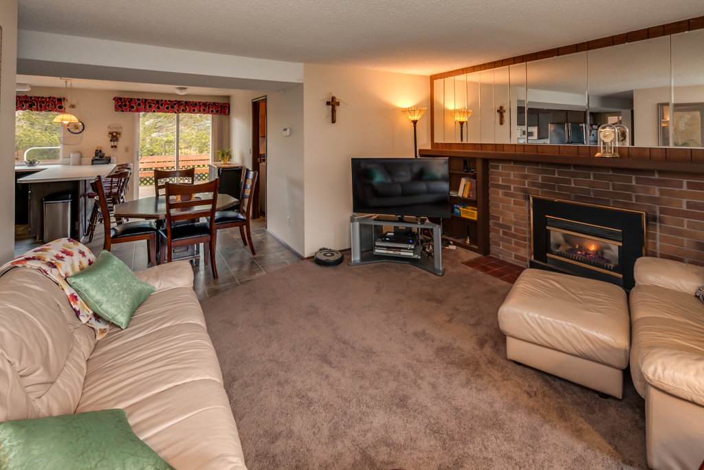 Property Photo: Looking across the family room toward the informal dining area and glass slider out to fenced rear yard beyond. 805 Bennett Ct  WA 98229 