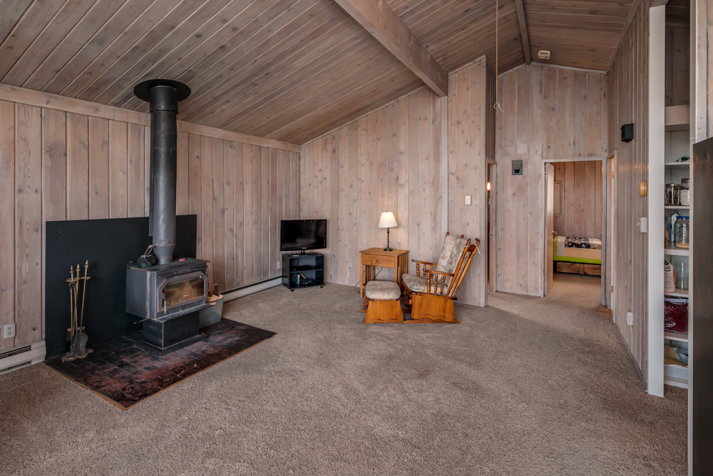 Property Photo: Living room with wood stove 4348 Saltspring Dr  WA 98248 